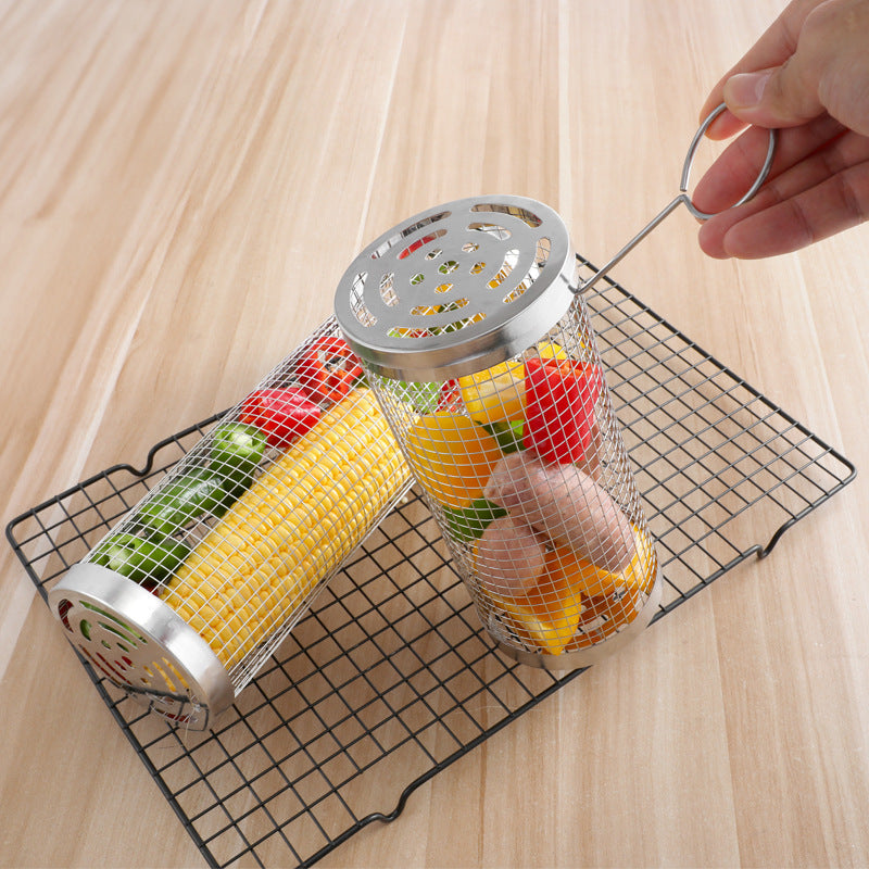 Metal mesh canisters with fruits and vegetables on a wire rack on a wooden surface.