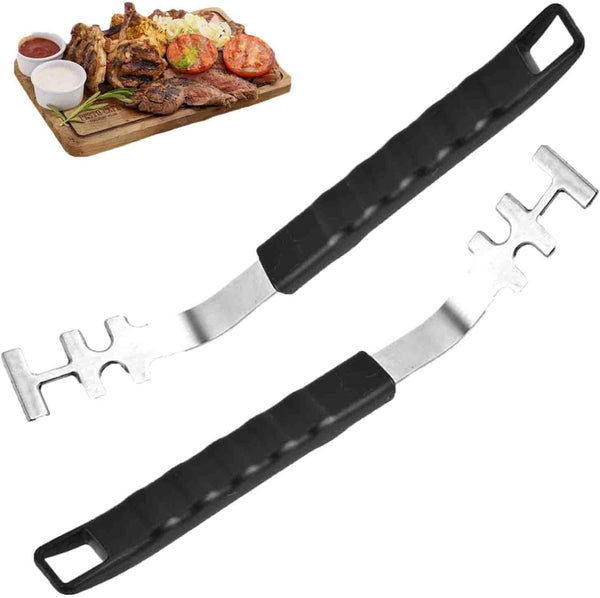 Two grill grate lifters with a plate of grilled meat and vegetables in the background.