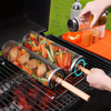 Person using a stainless-steel rotating grill basket with vegetables on a barbecue