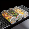 Stainless Steel mesh grilling baskets with vegetables on a grill