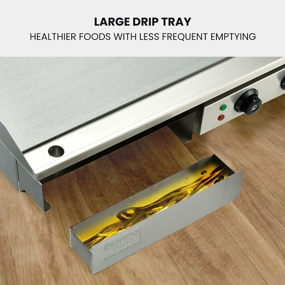 Large drip tray on a kitchen appliance with text indicating healthier food preparation.