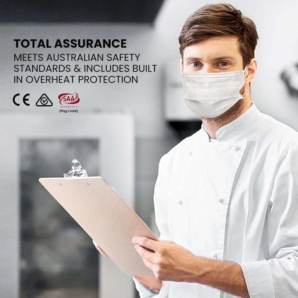 Person in a white uniform holding a clipboard with safety certification text and logos on a blurred background