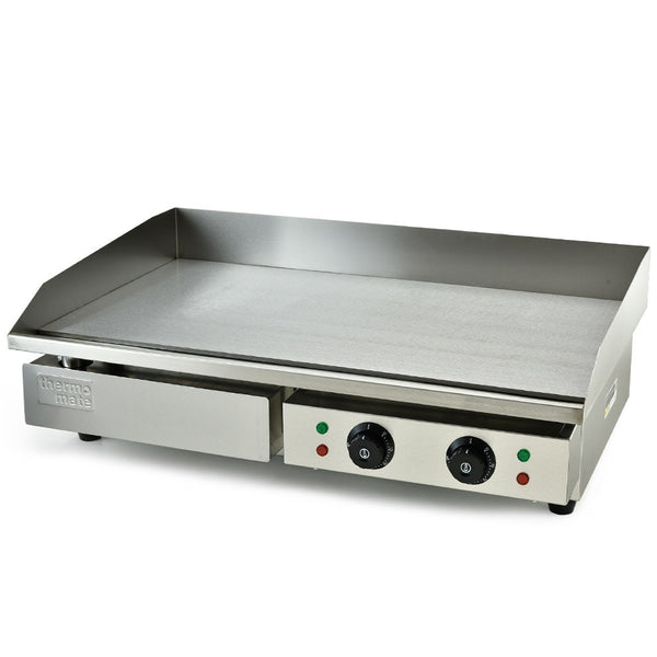 Stainless steel griddle with control knobs on a white background