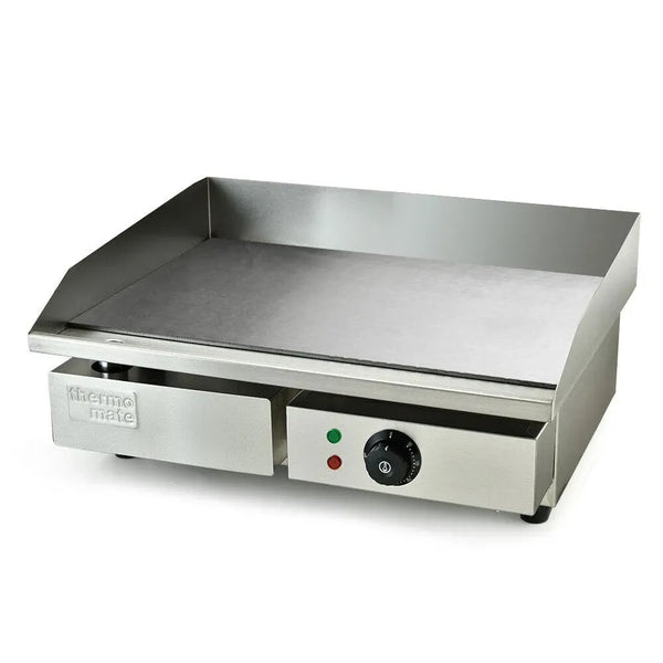 Stainless steel griddle with control panel on a white background