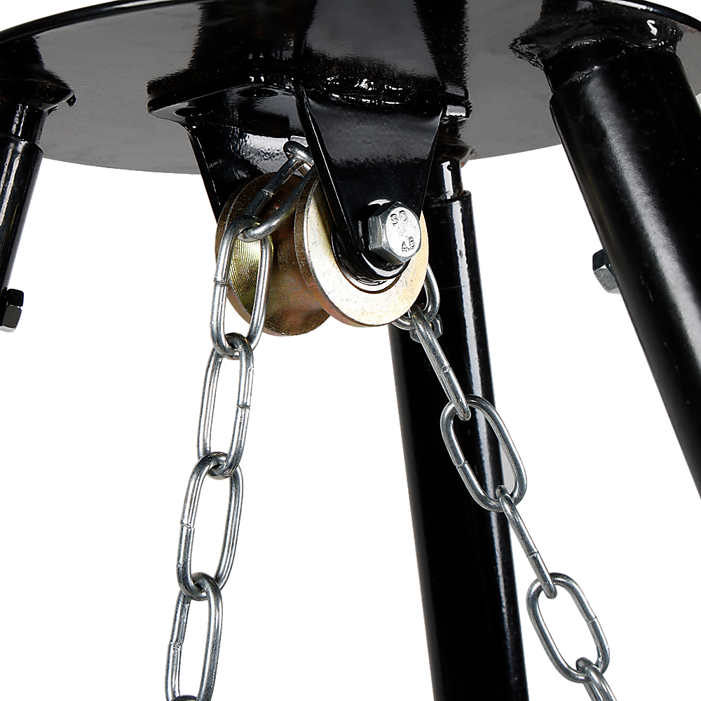 Close-up of the hanger on a black tripod garden fire pit, showing chain and rolling function.