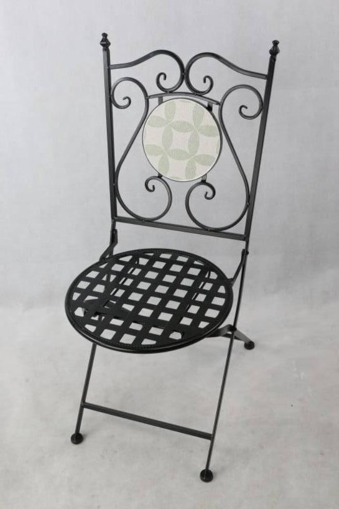 Black metal chair with decorative backrest on a light gray background