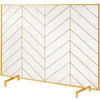 Gold metal fireplace screen divider with chevron pattern on a white background