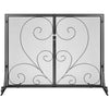 Decorative metal fireplace screen with intricate heart and swirl designs on a white background