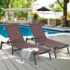 Two brown lounge chairs on a wooden deck by a pool with a blurred background