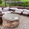 Stainless steel fire pit cover on a stone fire pit with outdoor furniture in the background