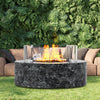 Outdoor fire pit with flames in a garden setting