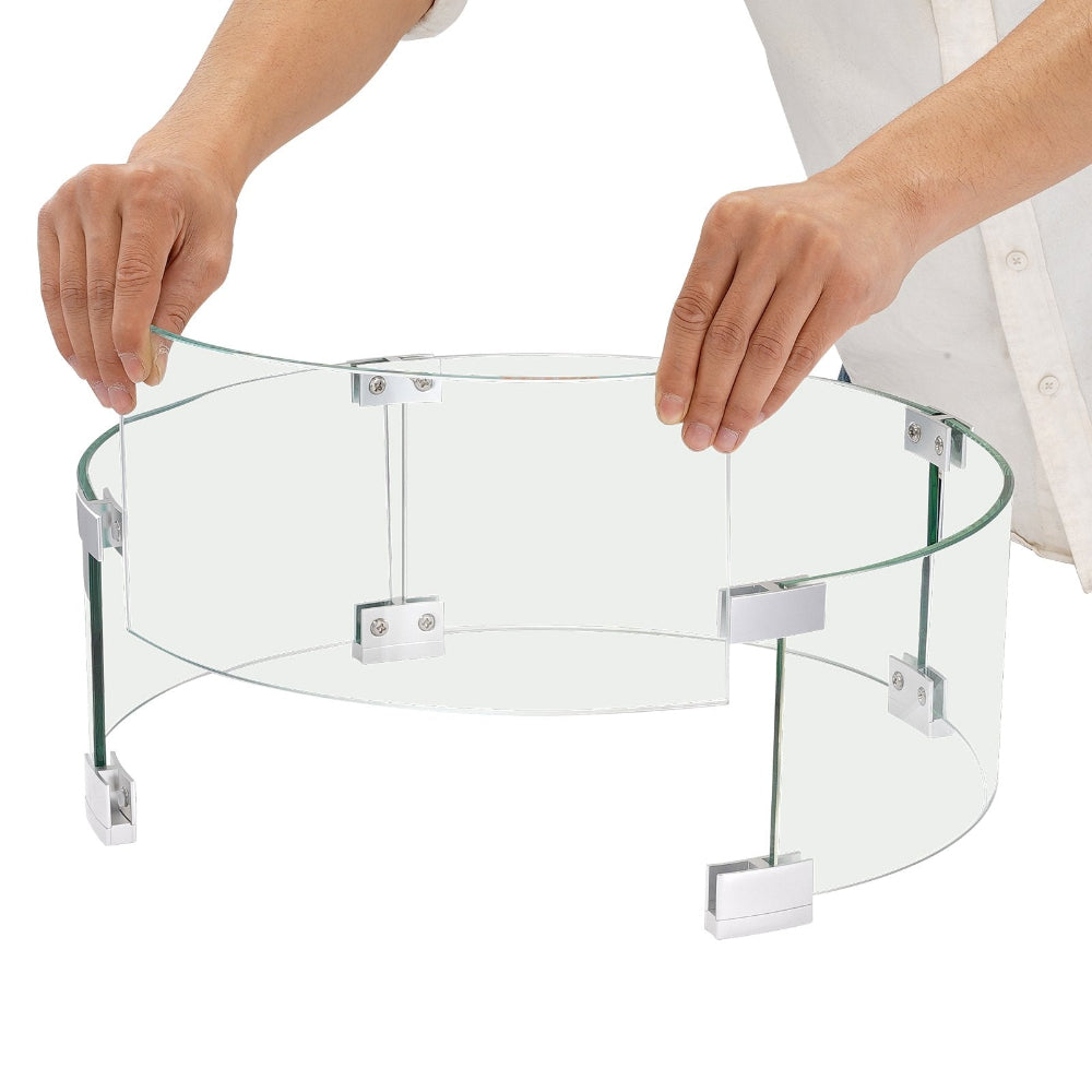 Clear glass table with metal legs being held by a person on a white background