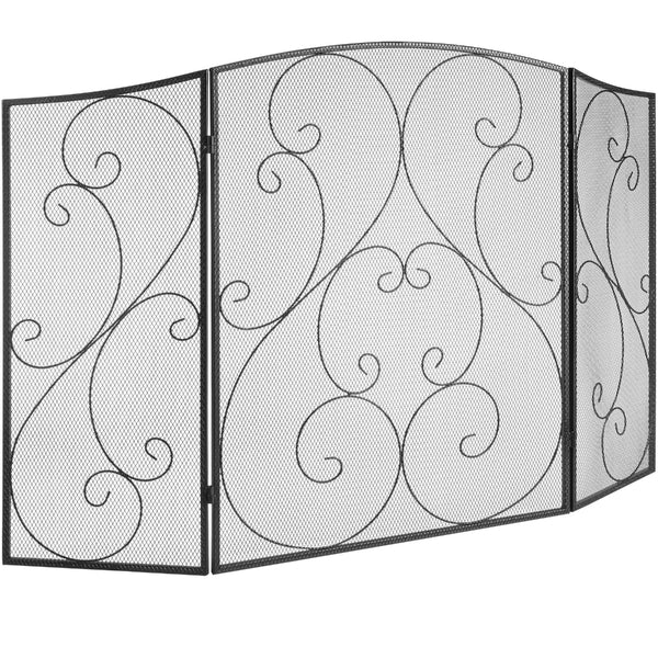 Decorative black metal fireplace screen with swirling patterns on a white background