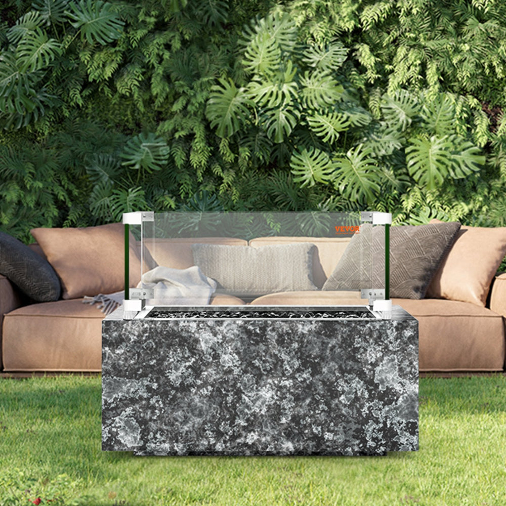 Fire pit table with glass cover in a garden setting