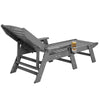 Gray outdoor recliner with a small table and glass on a white background
