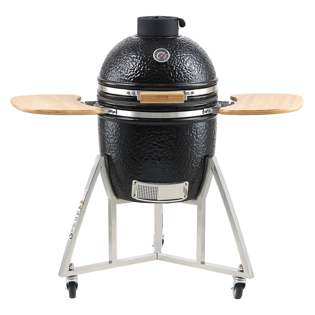 Black Kamado-style grill with wooden sides on a white background