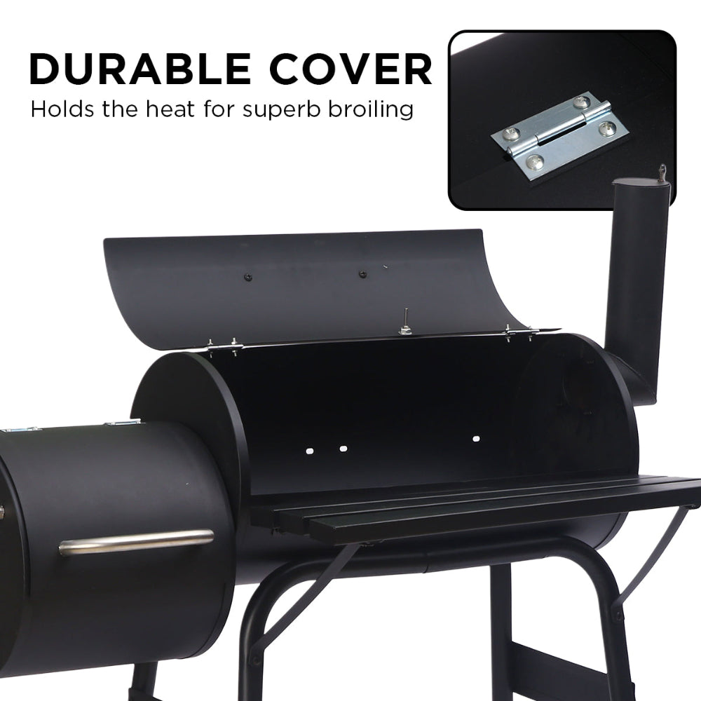 Black barbecue grill with a durable cover on a white background
