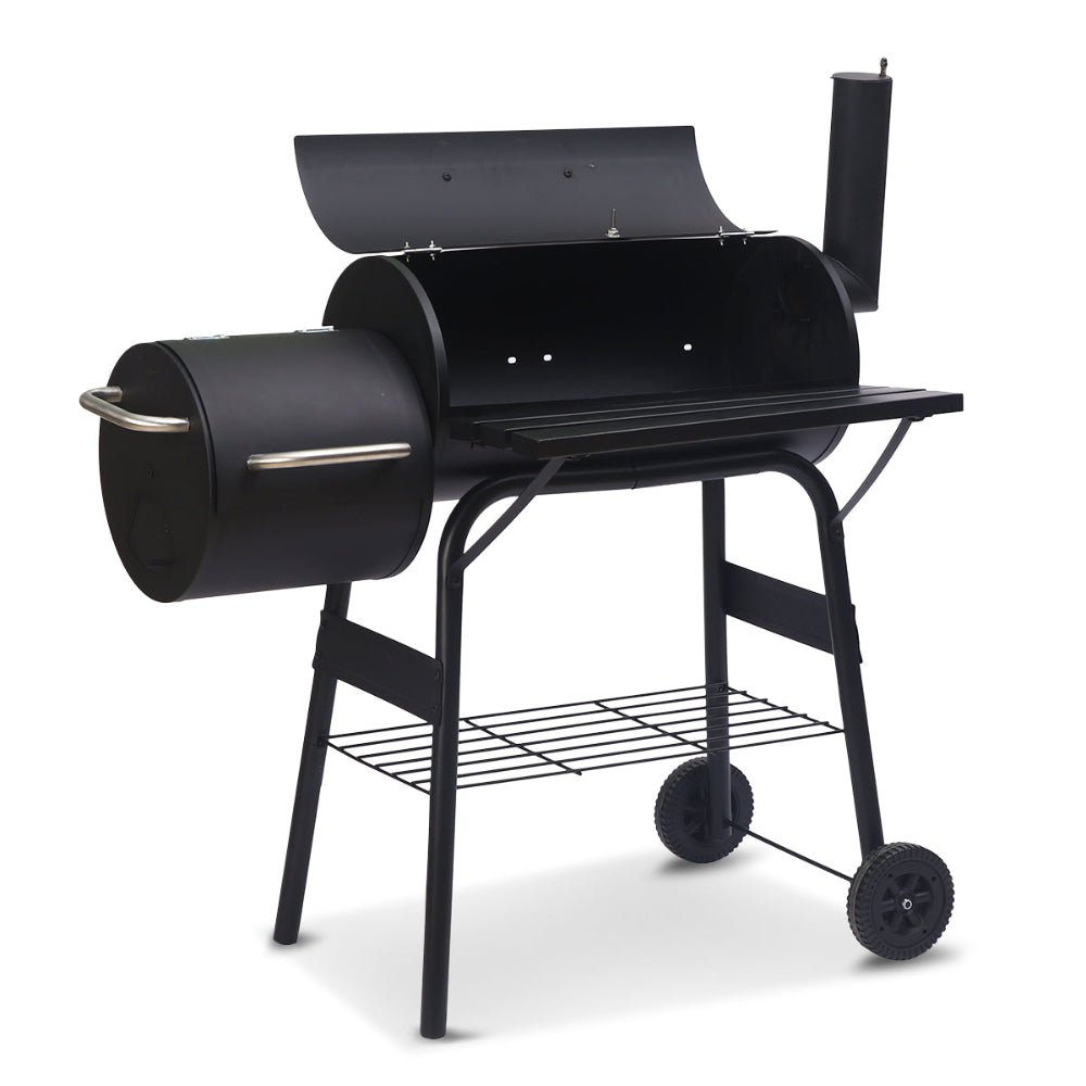 Black charcoal grill with wheels on a white background
