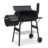 Black charcoal grill with wheels on a white background
