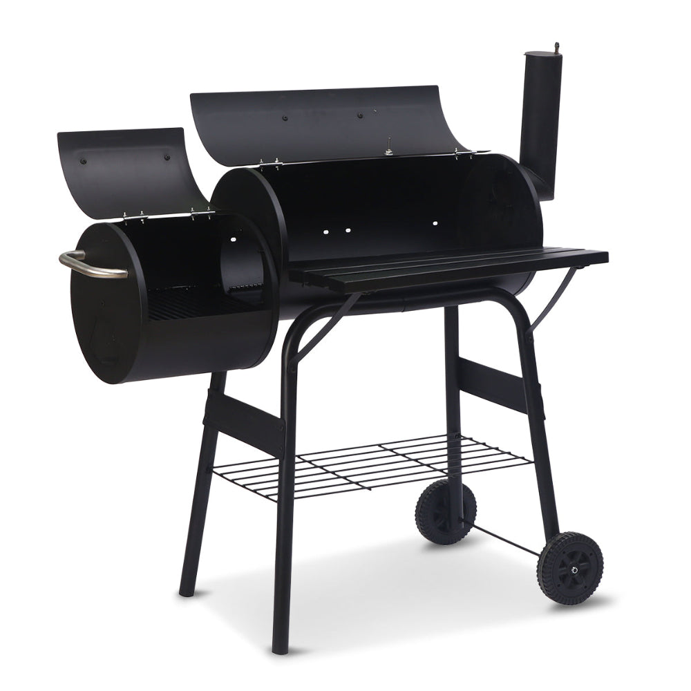 Black barbecue grill with wheels on a white background