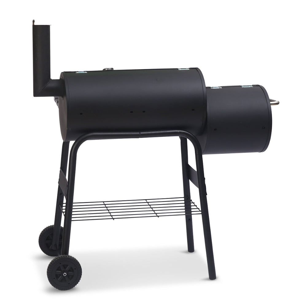 Black barrel-style barbecue grill on a white background