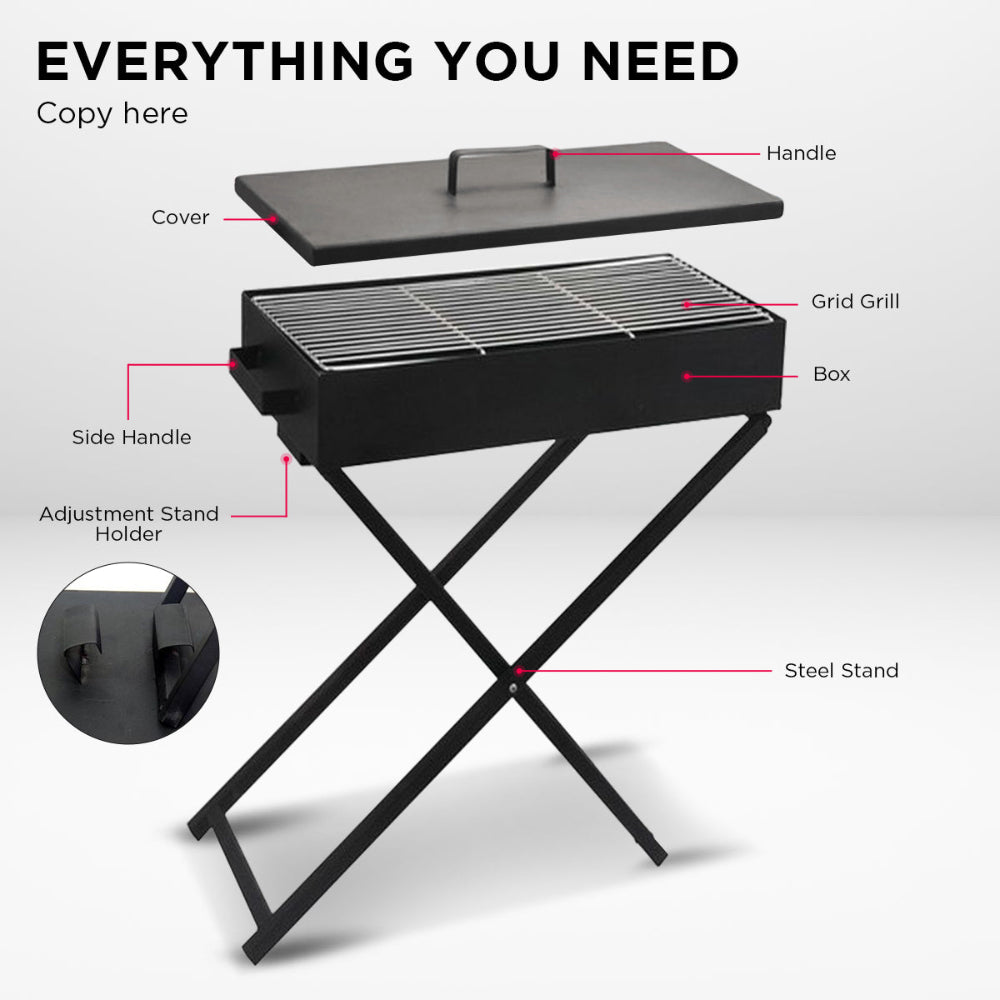 A portable charcoal grill with lid and foldable legs on a stand on a white background showcasing all the individual parts.