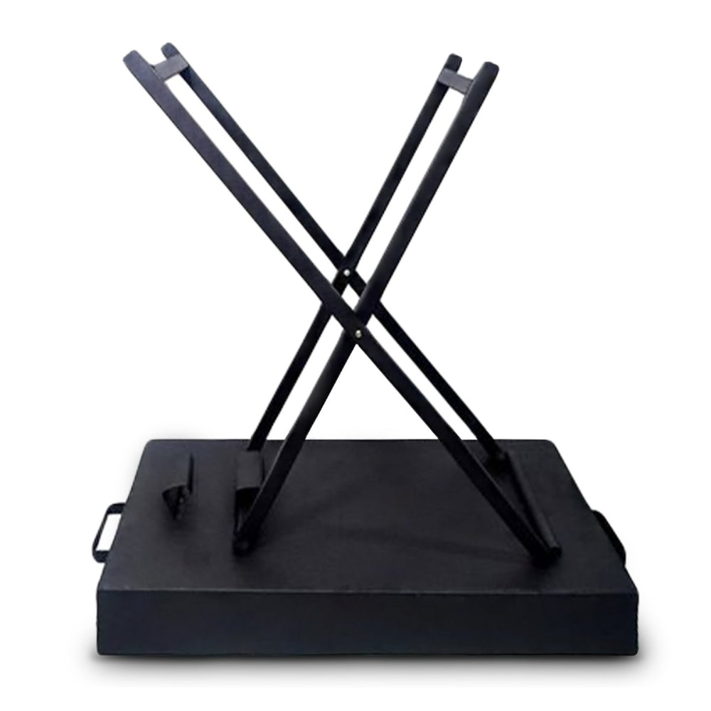 Upside down showing the foldable legs of a portable charcoal grill on a solid white background.