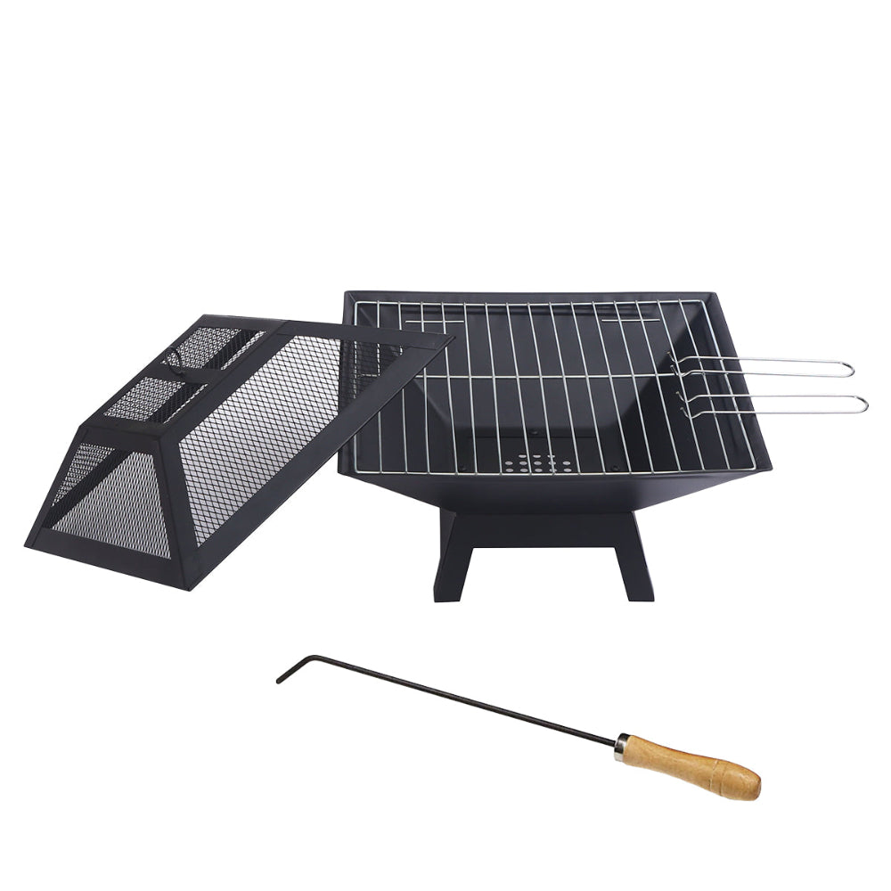 Portable grill with mesh lid and wooden-handled tool on a white background