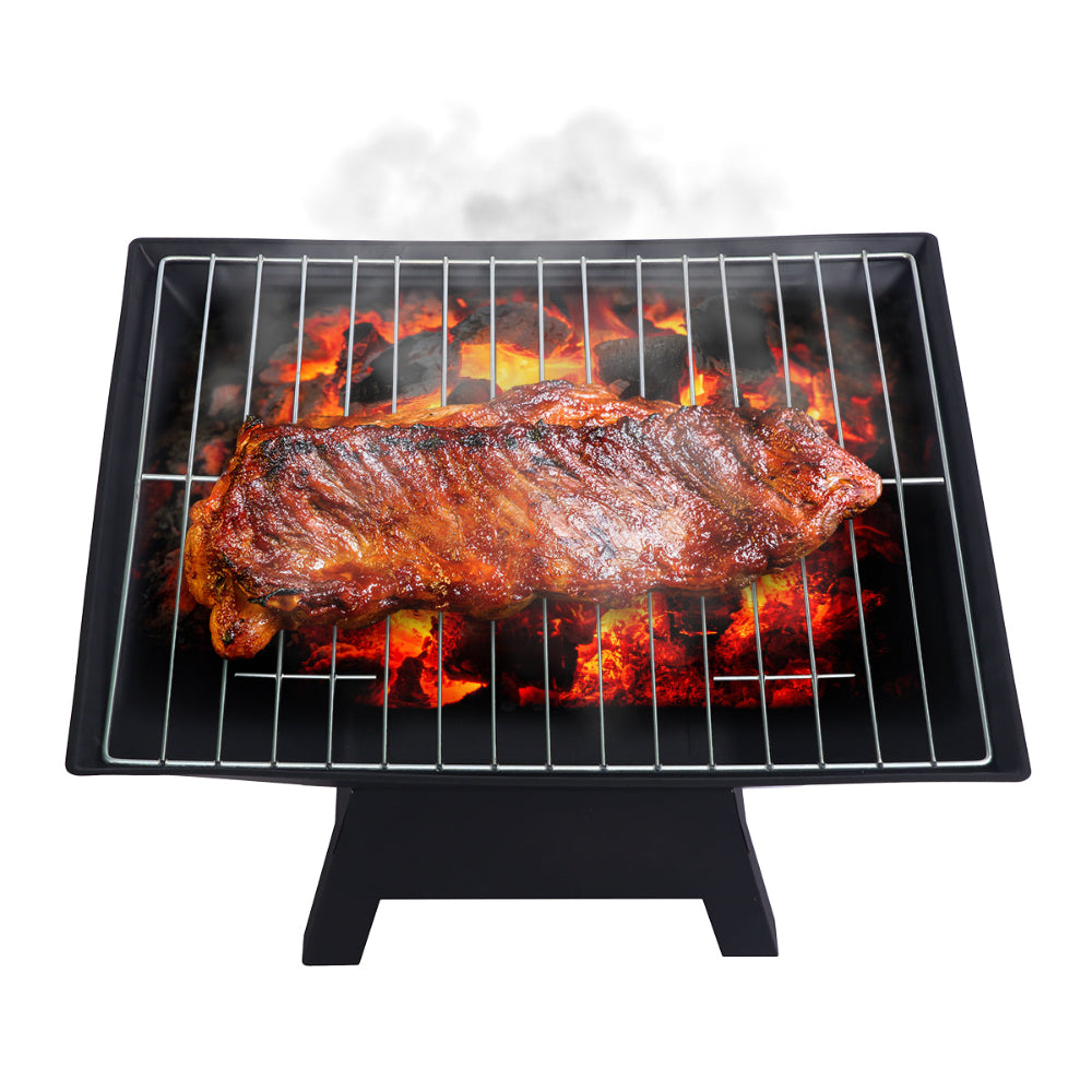 Barbecue grill with ribs over flames on a white background