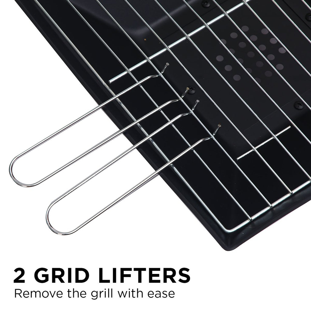 close up of a black portable outdoor fire pit with a grill and 2 lifters on top.