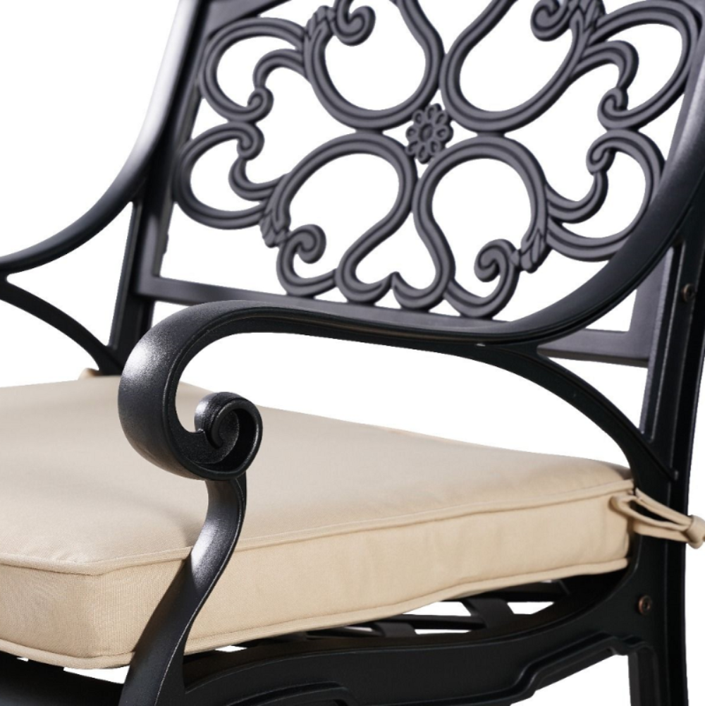 Close up of the Marco Cast Aluminium Outdoor Chair in back with beige cushion and a white background.