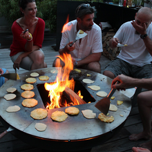 Load image into Gallery viewer, people cooking around the Yagoona Ringgrill BBQ &amp; Goanna Fire Pit Australia