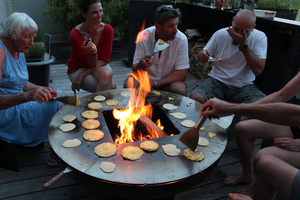 people cooking around the Yagoona Ringgrill BBQ & Goanna Fire Pit Australia
