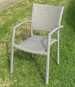 Clemence PE Wicker Chair on a lawn area