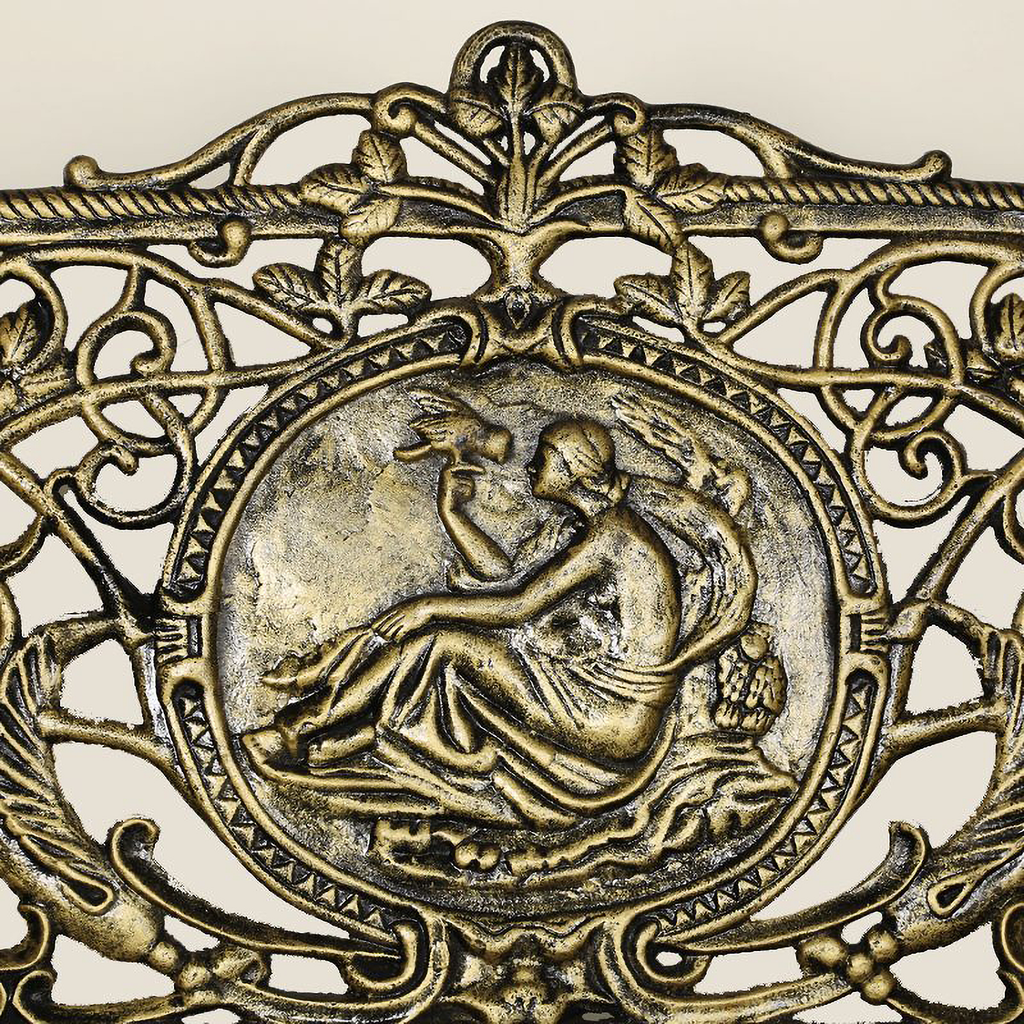 Close up of the Cameo in centre of Cast Iron Bench large size in black gold colour