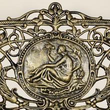Load image into Gallery viewer, Close up of the Cameo in centre of Cast Iron Bench large size in black gold colour