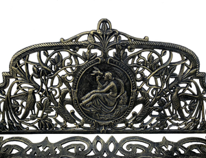 Close up image of the cameo detail in the Cameo Cast Iron Bench small size in black gold colour