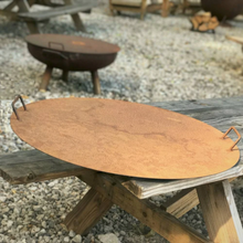 Load image into Gallery viewer, Fire Pit Metal Lids one on a fire pit and one on a wooden bench