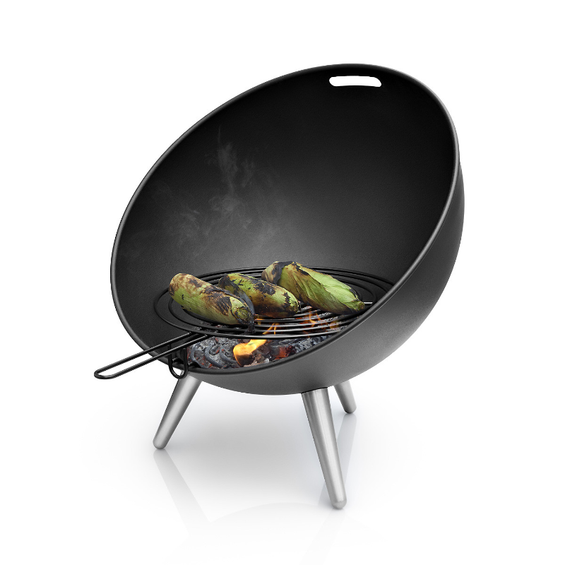 Eva Solo Fireglobe Grill Grid BBQ Accessory cooking 3 corn cobs in the Fireglobe fire pit on a white background.