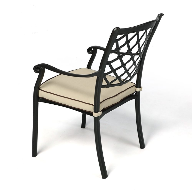 Fuji sand black Chair with cream seat cushion at a side angle view. 