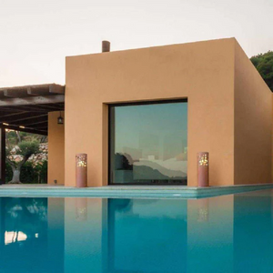 Gustav Commerce Corten Finish Outdoor Fireplaces outside near a swimming pool