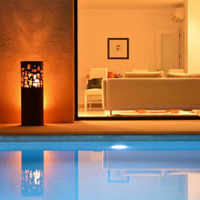 Load image into Gallery viewer, The Gustav Commerce Corten Finish Outdoor Fireplace beside a swimming pool