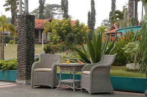 Roma 3 Piece Natural Aged KUBU Wicker Set in an outdoor garden space