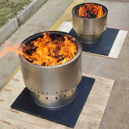 Two Smokeless Stainless Steel Fire Pits with fires burning