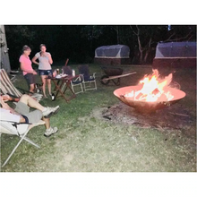 Load image into Gallery viewer, The 1500mm Cauldron Fire Pit at camp site with fire burning