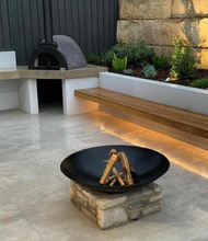 Load image into Gallery viewer, Cauldron 80cm Cast Iron Fire Pit in an outdoor entertainment space