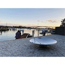 Load image into Gallery viewer, The Cauldron 100cm Stainless Steel Fire Pit and poker at a seaside setting