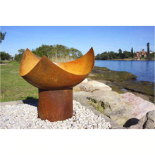 Load image into Gallery viewer, he Chalice Fire Pit in natural rust colour at the seaside 