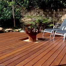 Load image into Gallery viewer, The Flame Dancer Fire Pit set up in a garden fire pit area
