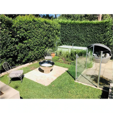 Load image into Gallery viewer, The Goblet Stainless Steel Fire Pit on the 150mm stand in backyard setting